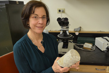 Marie Jackson holding a 2,000-year-old sample of maritime concrete