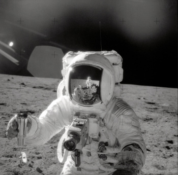 Apollo 12 astronaut, Alan L. Bean,, collecting lunar regolith.