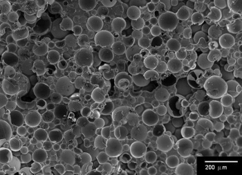 Micrograph of an epoxy matrix syntactic foam filled with glass microballoons