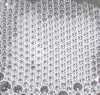 Ordered array of soap bubbles (bubble raft)